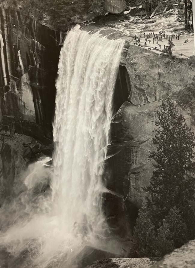 Soldiers at the top of a raging waterfall