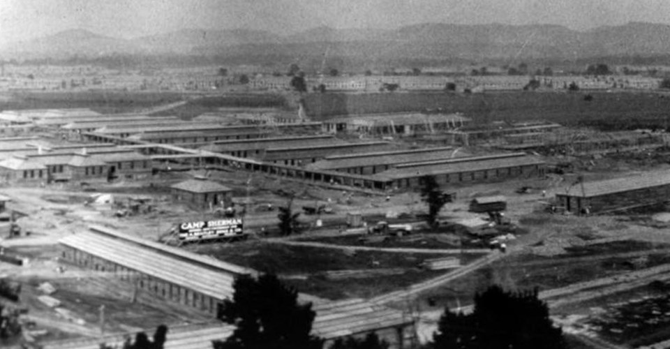 Camp Sherman under construction Several buildings under construction beyond a tree line