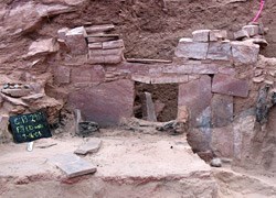stabilization rock wall prior to backfilling Red stone wall stabilized.