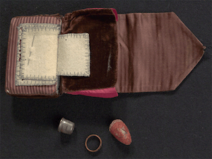 cloth book with thimble and needle
