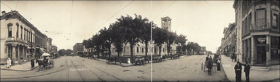 Photo shows main town square in between two streets. Library of Congress.