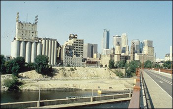 Photo of industrial buildings along a waterway. (Minnesota State Historic Preservation Office)