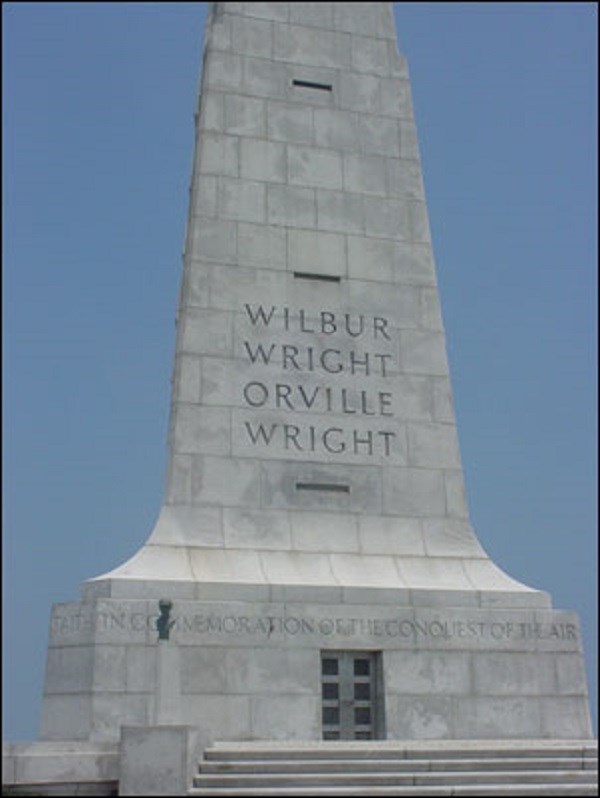 White stone monument to the Wright Brothers.