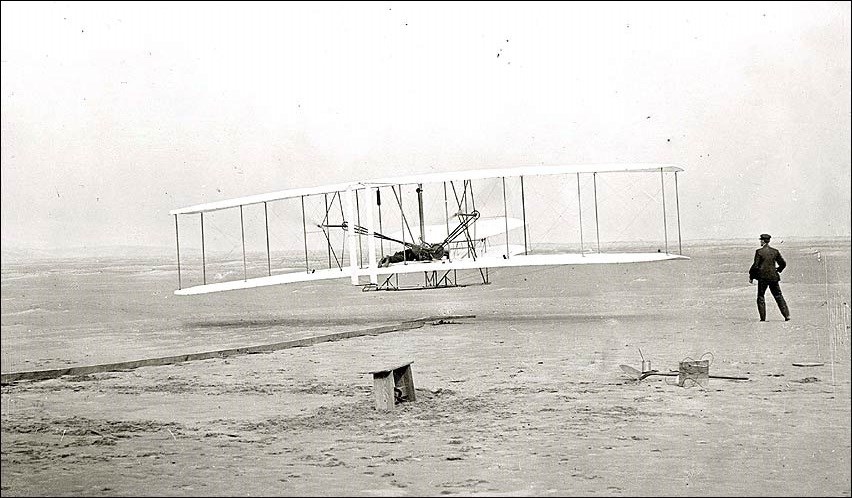 Wright brother taking off in plane for first time in 1903. (National Air and Space Museum, Smithsonian Institution, SI-2002-16646)
