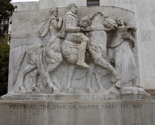 1127 relief sculpture of horse and two men