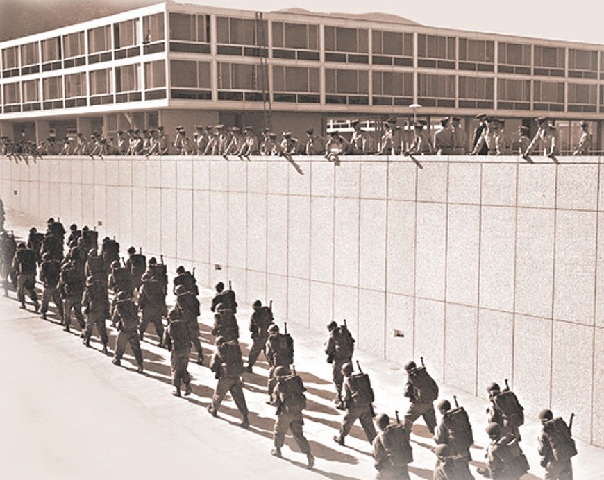 Cadets marching up a ramp.