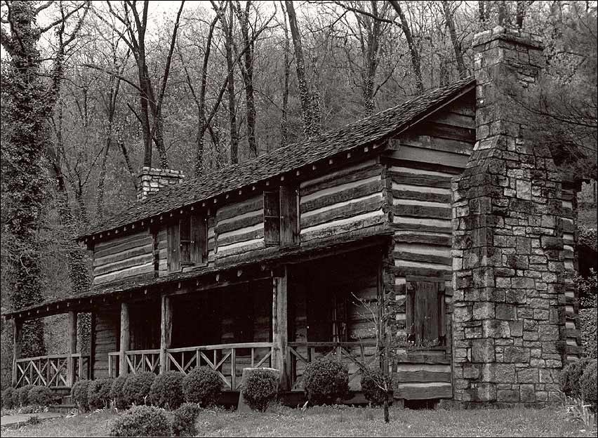 Two-story log cabin.