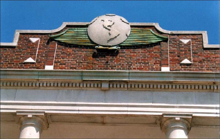 Top part of Ryan Visitor Center at Floyd Bennett Field, showing emblem of a stylized globe seal, 2002.(Floyd Bennett Field Task Force) Top part of Ryan Visitor Center at Floyd Bennett Field, showing emblem of a stylized globe seal, 2002.(Floyd Bennett Field Task Force)