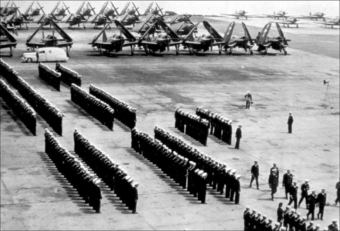 Inspection of ferry squadrons, with uniformed men standing in straight rows, NAS New York, c. 1944. Inspection of ferry squadrons, with uniformed men standing in straight rows, NAS New York, c. 1944.