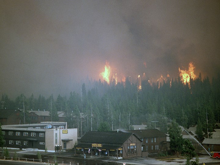 Crown fire approaching Old Faithful Snowlodge; Jeff Henry; September 7, 1988