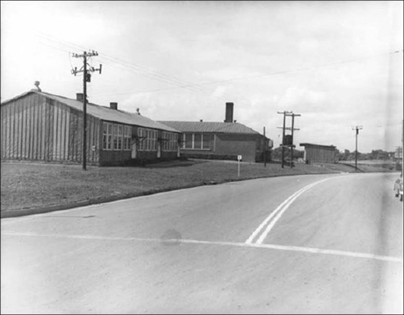 Photo of one story buildings along a street. (Courtesy of the National Archives and Records Administration)