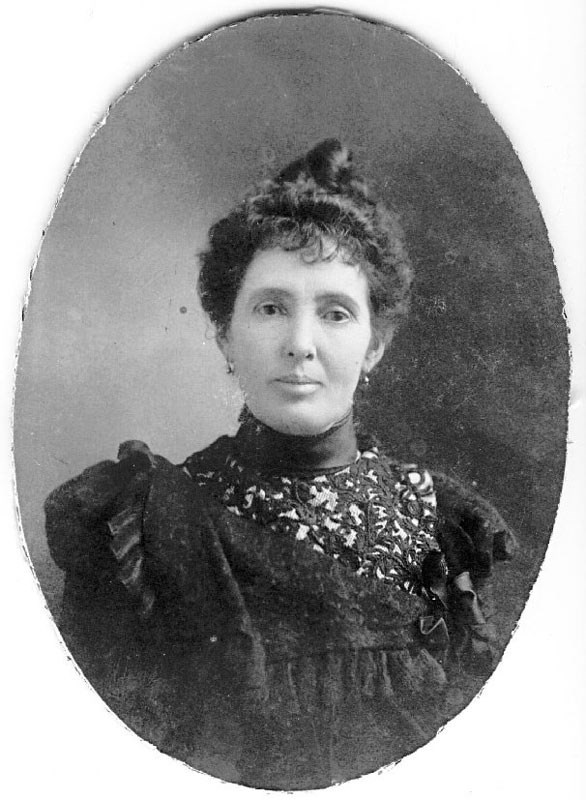 Photo of a woman from the waist up.
