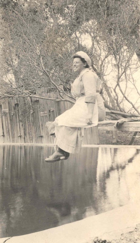 Woman sitting by the water. Woman sitting by the water.