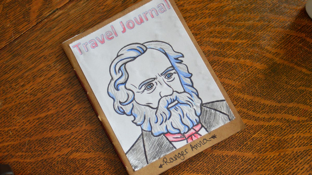 handmade paper journal with image of Henry Wadsworth Longfellow on cover