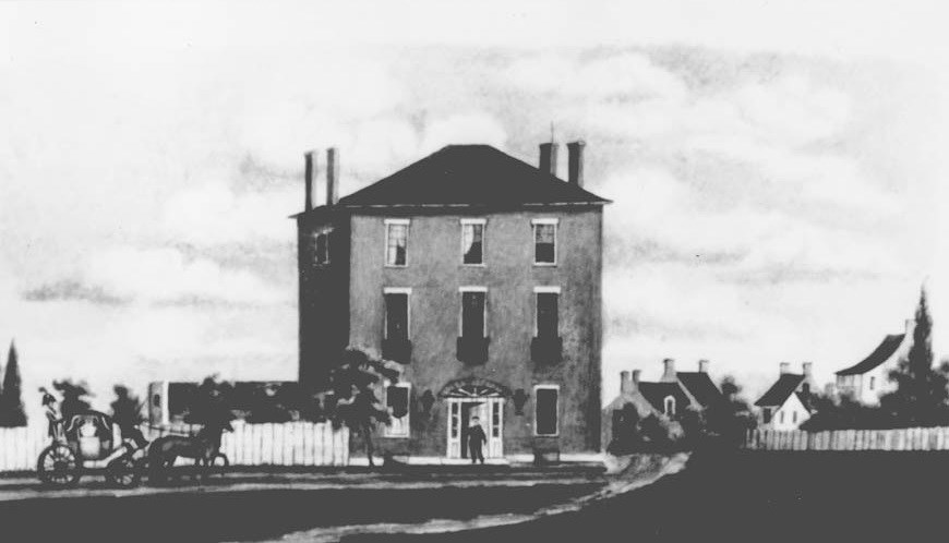 Drawing of a three-story brick house.