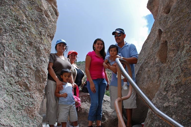Family standing at top of stairs