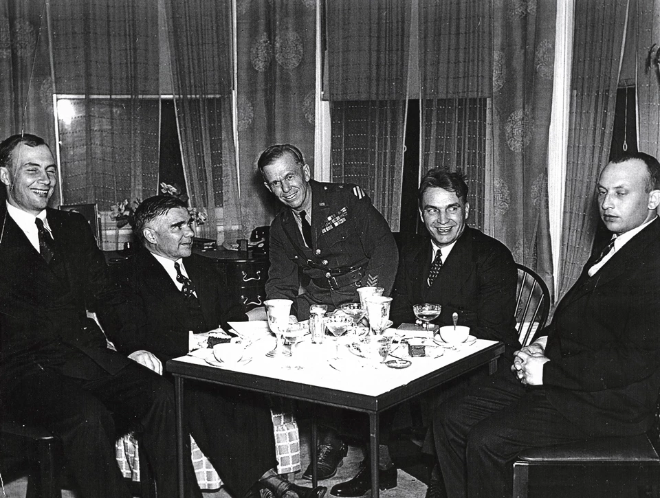 Marshall and Russian crew Photo of men seated at table