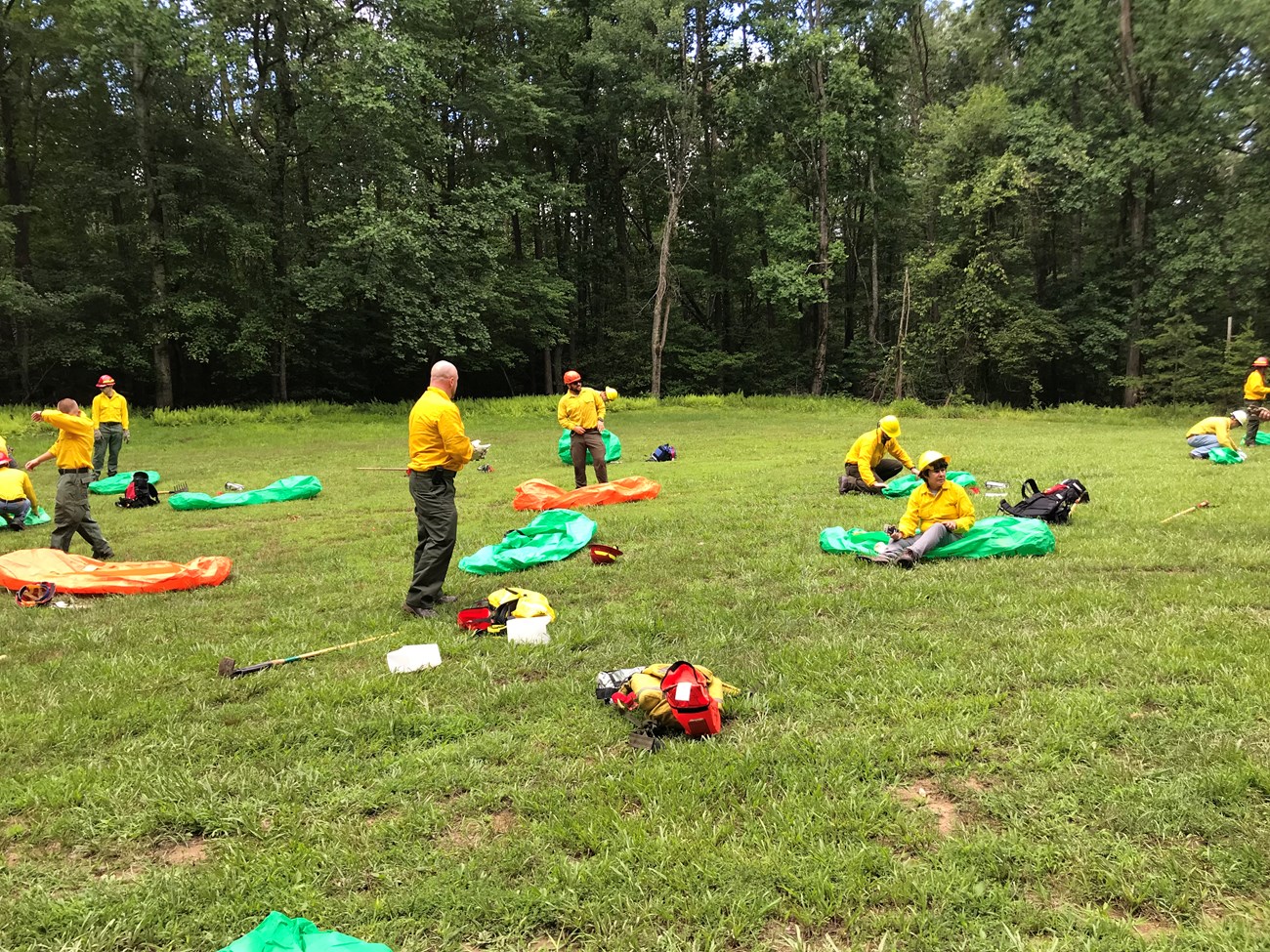 2019 Wildfire Simulated Shelters in Prince William Forest Park Several wildland fire trainees simulate deploying fire shelters.