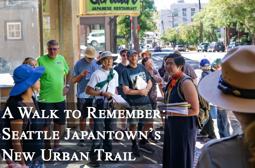Visitors to the Japanese American Remembrance Trail listen to a Wing Luke tour guide explain a historic site. Photo courtesy of Alabastro Photography