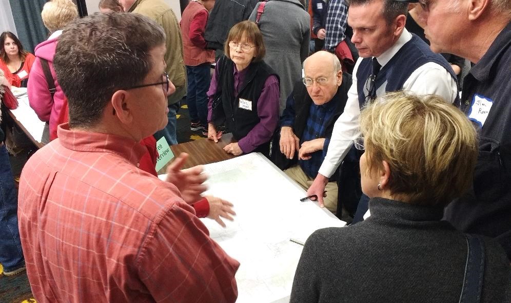 Community members gather around a map to share their thoughts for the trail network. Photo courtesy of Dan Miller, National Park Service.