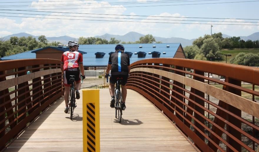 Bicyclists riding the newly constructed section of the Jordan River Parkway within West Jordan City. National Park Service photo. Bicyclists riding the newly constructed section of the Jordan River Parkway within West Jordan City. National Park Service photo.
