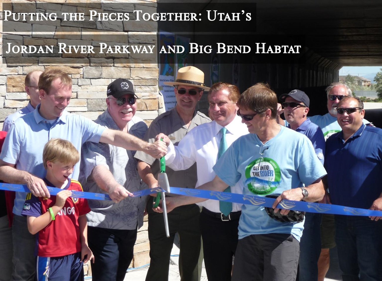 Cover image showing the West Jordan City trail ribbon cutting event. Title reads "Putting the Pieces Together: Utah's Jordan River Parkway and Big Bend Habitat." Cover image showing the West Jordan City trail ribbon cutting event. Title reads "Putting the Pieces Together: Utah's Jordan River Parkway and Big Bend Habitat."