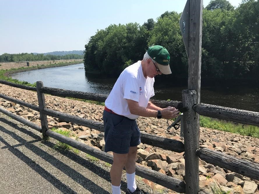 Jack Walsh of the Naugatuck River Greenway Steering Committee monitors the
trail counter on the Naugatuck River Greenway in Derby. Kendra Barat,
National Park Service photo. Jack Walsh of the Naugatuck River Greenway Steering Committee monitors the trail counter on the Naugatuck River Greenway in Derby. Kendra Barat, National Park Service photo.