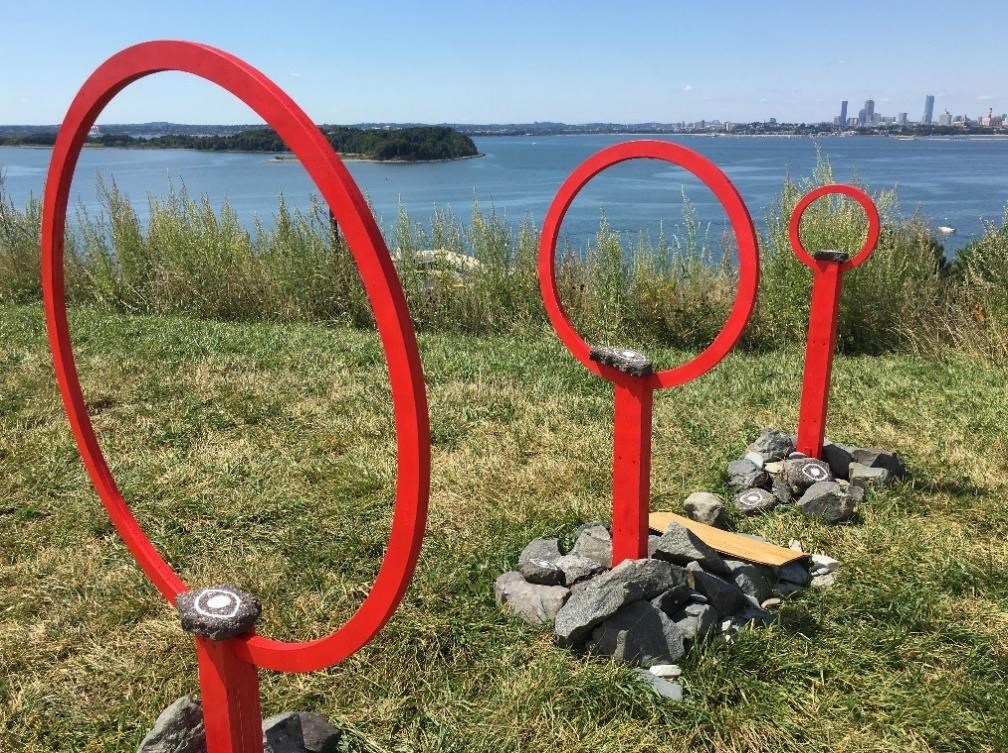 One of the two “Harboring Project” sculptures is a line of three freestanding red rings of different sizes. National Park Service photo. One of the two “Harboring Project” sculptures is a line of three freestanding red rings of different sizes. National Park Service photo.