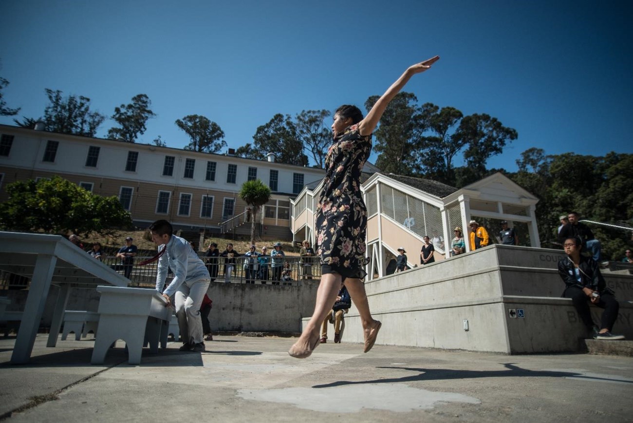 Dancers Lynn Huang and Wayne Tai Lee use the Immigration Station as a stage, captivating audience members in Lenora Lee Dance’s "Within These Walls." Photo courtesy of Robbie Sweeny, Lenora Lee Dance.