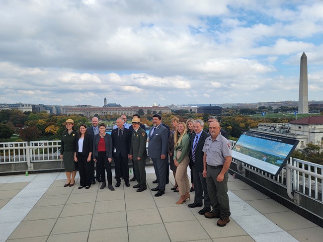 2020-2021 Director and Winners a group of people on a roof top, the Washington Monument in the background