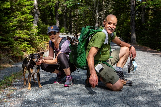 Couple and dog Visitors with dog on leash