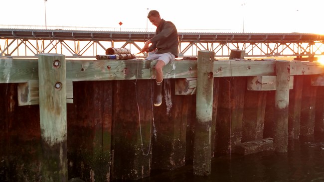 lt= Ryan Anderson (Stony Brook University) cleans sensors used to collect water quality data in Jamaica Bay.
