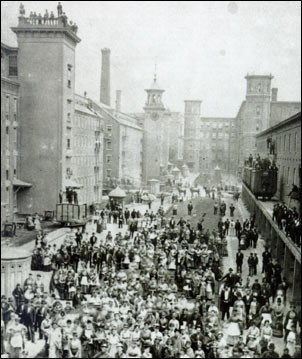 Photo of crowded street with industrial buildings. (Lowell Museum Collection/Lowell Historical Society) Photo of crowded street with industrial buildings. (Lowell Museum Collection/Lowell Historical Society)
