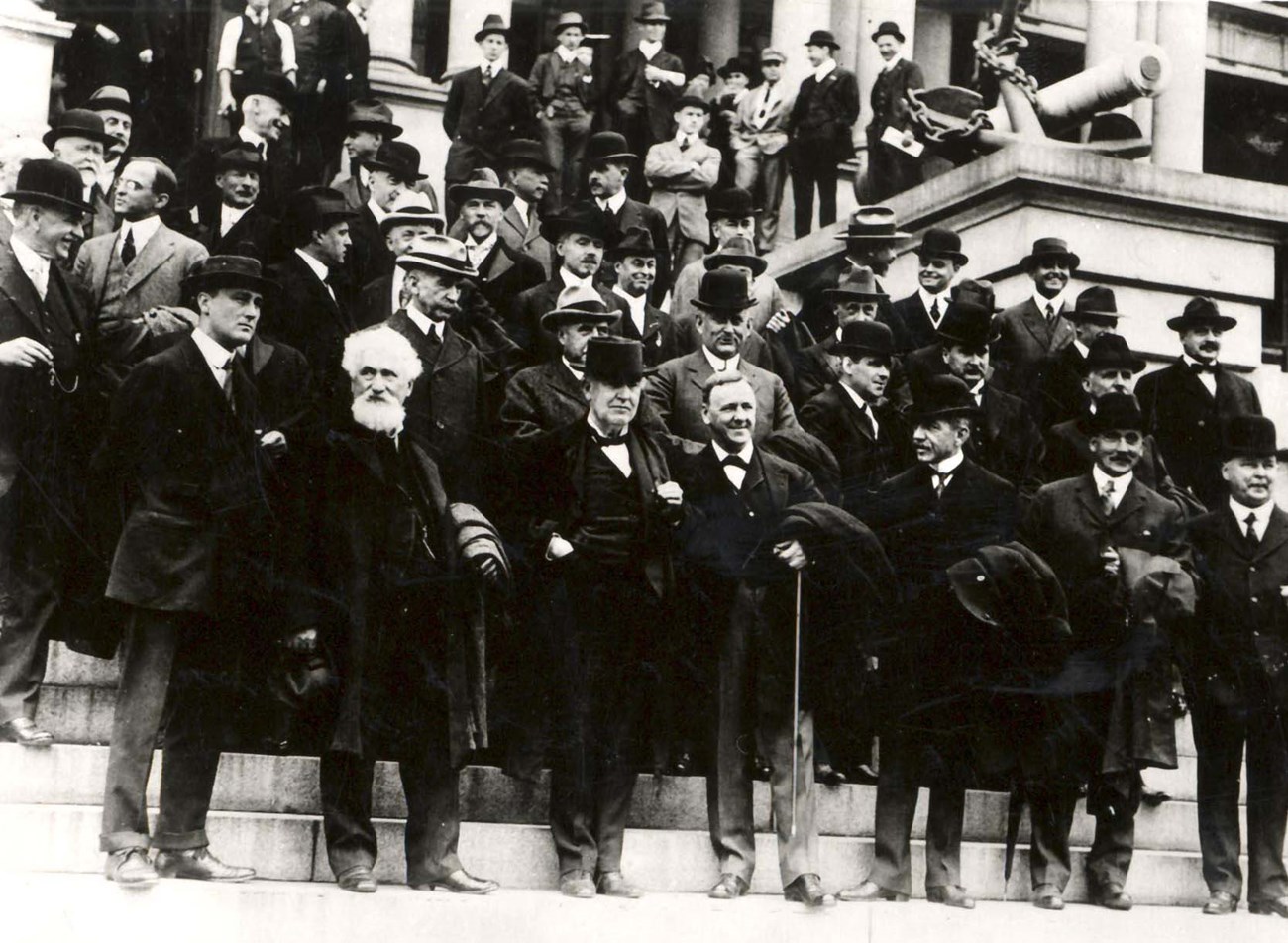 Edison with the Naval Consulting Board on the east steps of the State, War and Navy Building, October 7, 1915. Navy Secretary Josephus Daniels stands to Edison’s left. Assistant Navy Secretary Franklin D. Roosevelt is in the front row, far left. Edison with the Naval Consulting Board on the east steps of the State, War and Navy Building, October 7, 1915. Navy Secretary Josephus Daniels stands to Edison’s left. Assistant Navy Secretary Franklin D. Roosevelt is in the front row, far left.