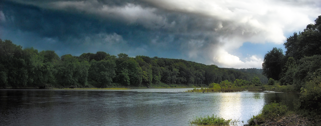 Dark storm clouds gathering over the Delaware River. Dark storm clouds gathering over the Delaware River.