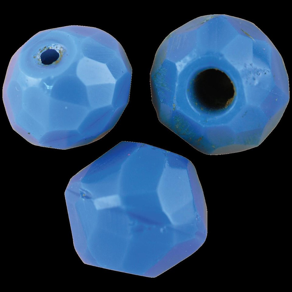 Three light blue spherical beads with many ground facets.