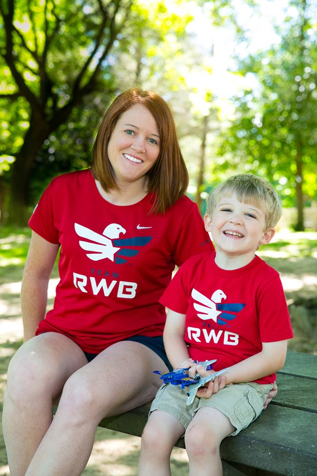 Casey McCabe and son wearing "Team RWB" shirts