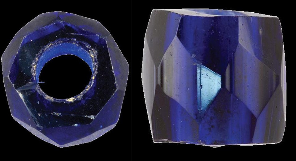 End and side view of a dark blue transparent bead.
