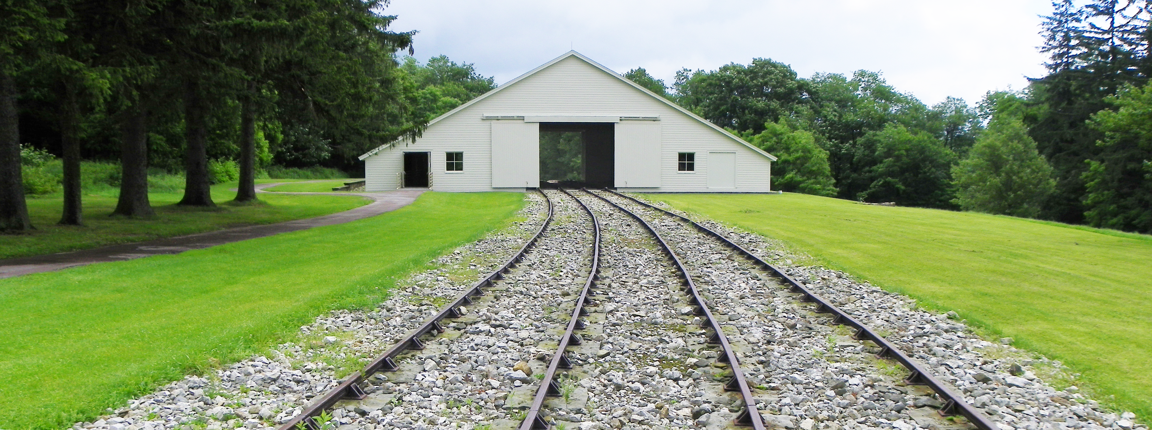 A railroad extending into the distance through an engine house. A railroad extending into the distance through an engine house.