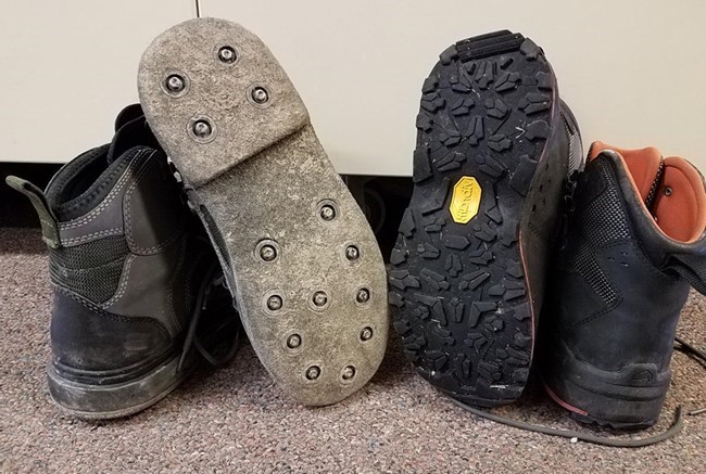 soles of fishing boots side by side