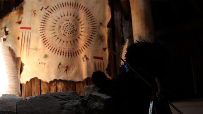 3KNRI toy dog inside earthlodge