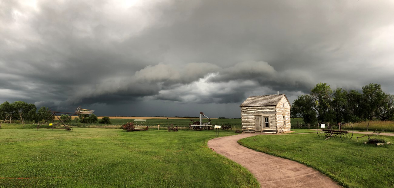 Storm cloud over HC Storm clouds move over historic cabin.