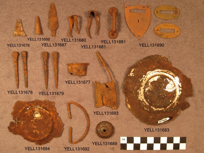Figure 4. Artifacts collected from the Radersburg Abandoned Wagon site (48YE2020): a pen nib, shotshells, snap hook, buckles, and harness terret (Eakin 2012a). Photo - Office of Wyoming State Archaeologist.