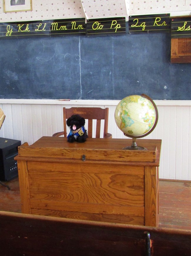 stuffed pup in schoolhouse