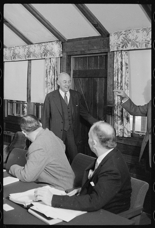 National Security Council at Camp David Man at a doorway to a room