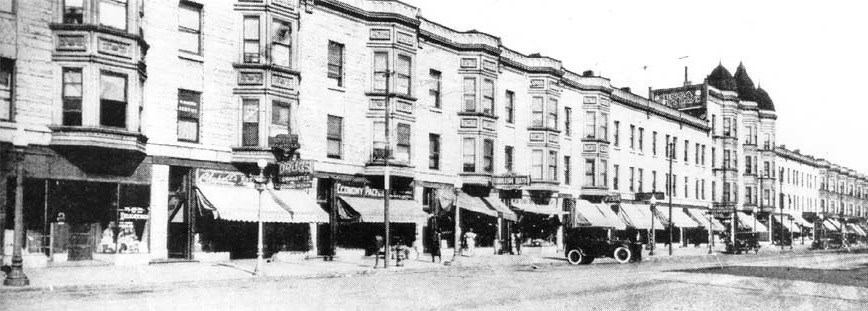 Photo of State Street in Chicago with brick houses, 1925. (The Negro in Chicago, 1779-1929, Washington Intercollegiate Club of Chicago, Inc., 1929.)