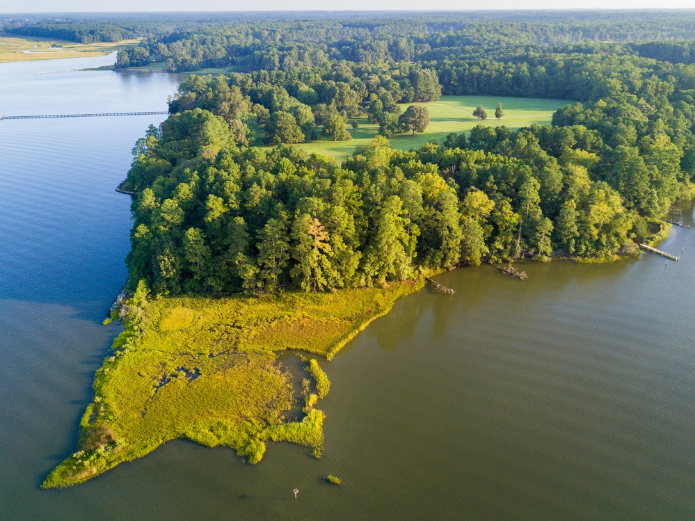 Chesapeake Bay Arial view of a green peninsula jutting out into bay area