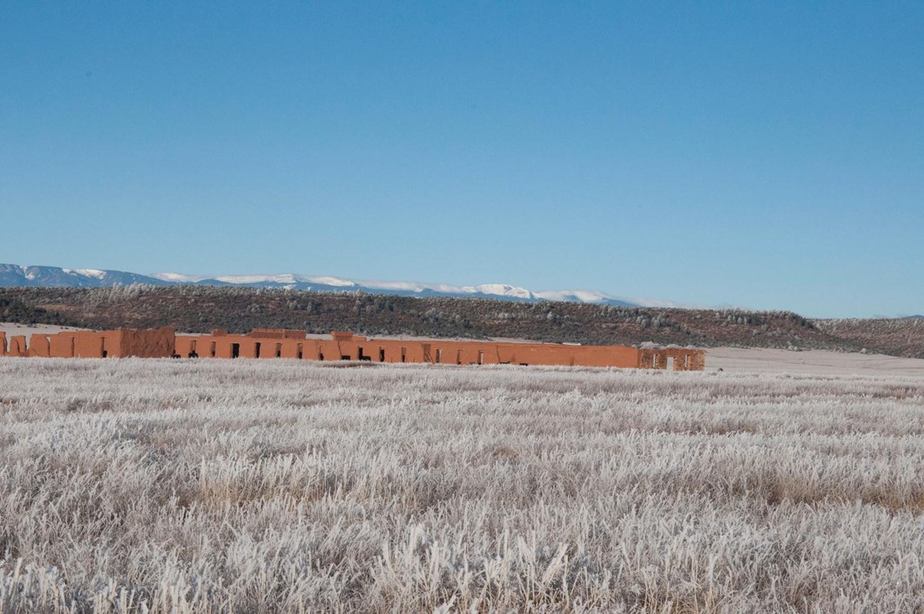 59F581F1-155D-451F-67CF10A7153A7627Original Fort Union Depot Warehouses. Sangre de Cristo Mountian range in extreme background.