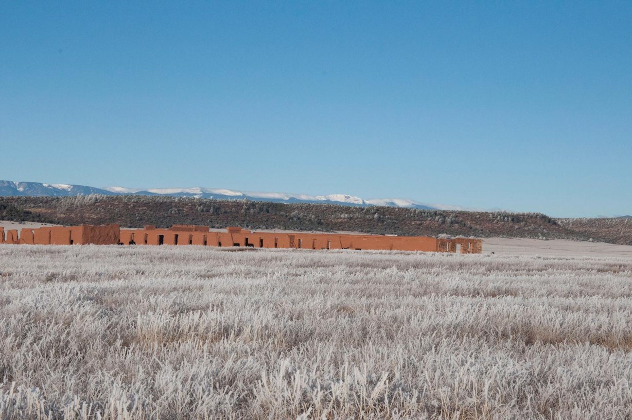 Fort Union Depot Warehouses. Sangre de Cristo Mountian range in extreme background.