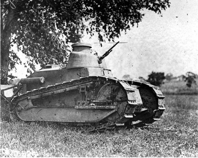 A Renault FT-17 parked under a tree.